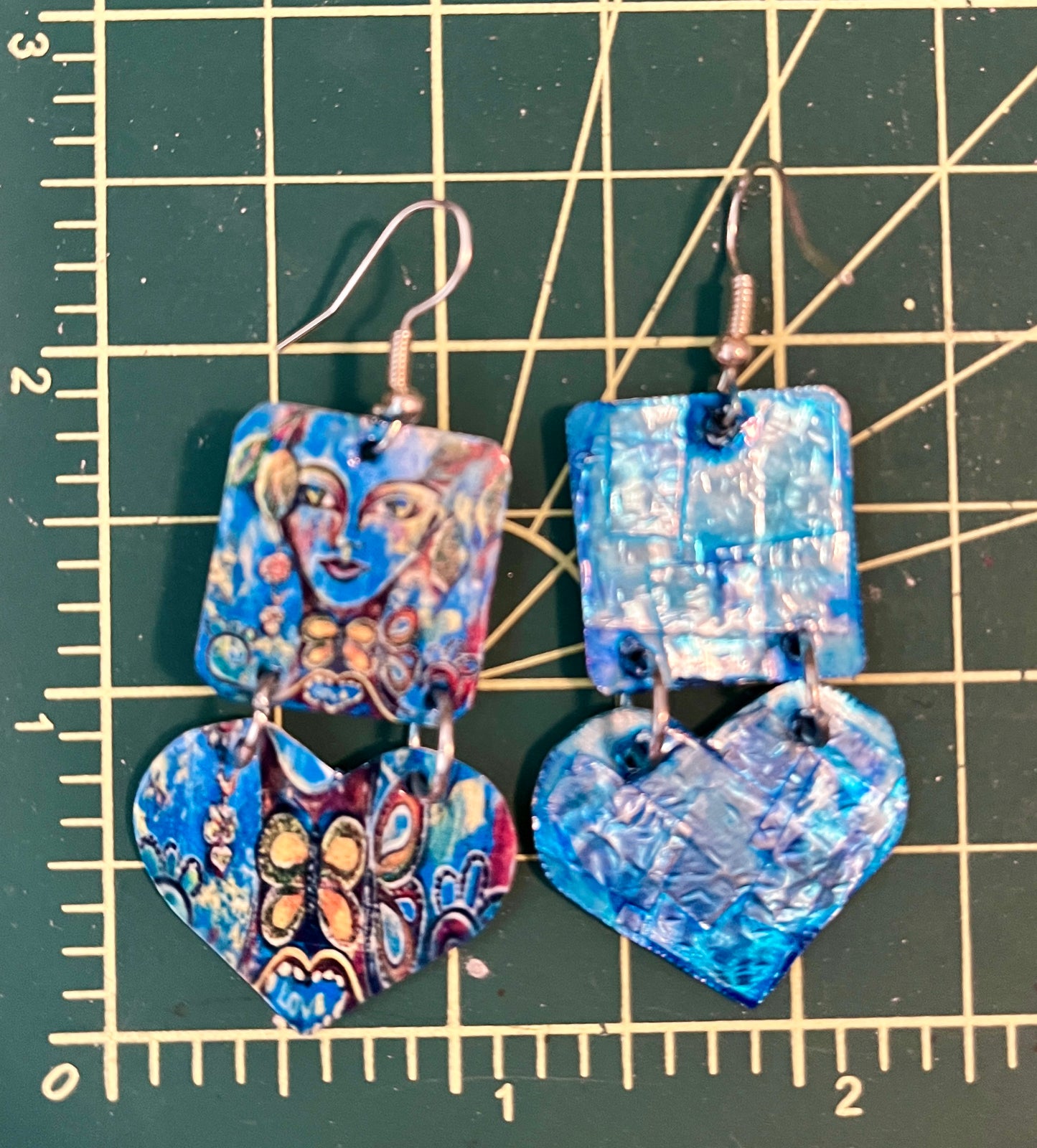 Face and heart earrings